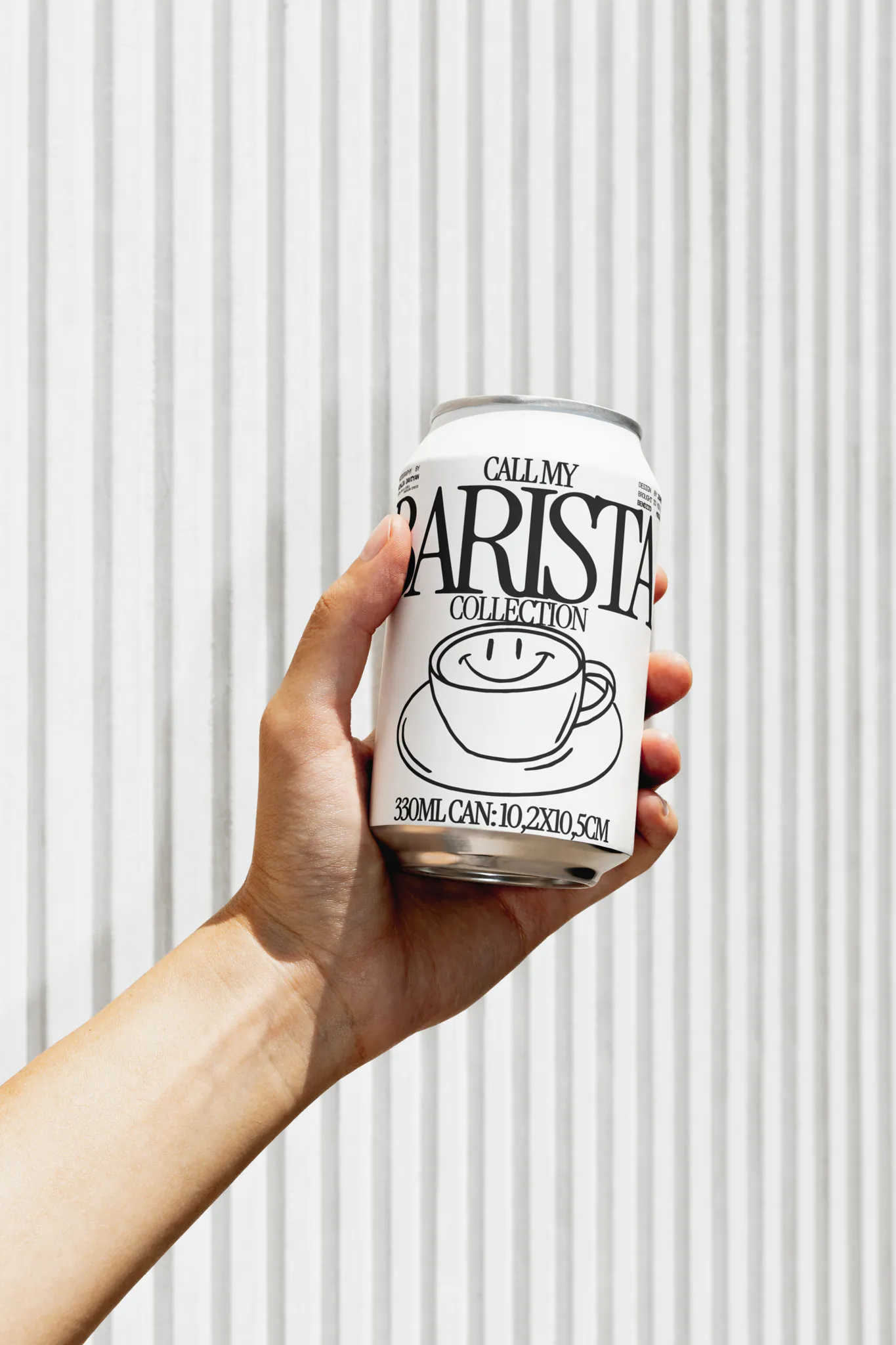 Minimalist coffee can design in hand – black and white packaging with bold typography